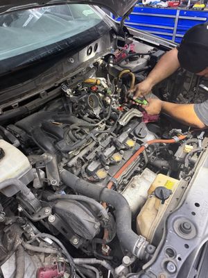 Mechanic performing an engine teardown at Street Kings Performance & Repair